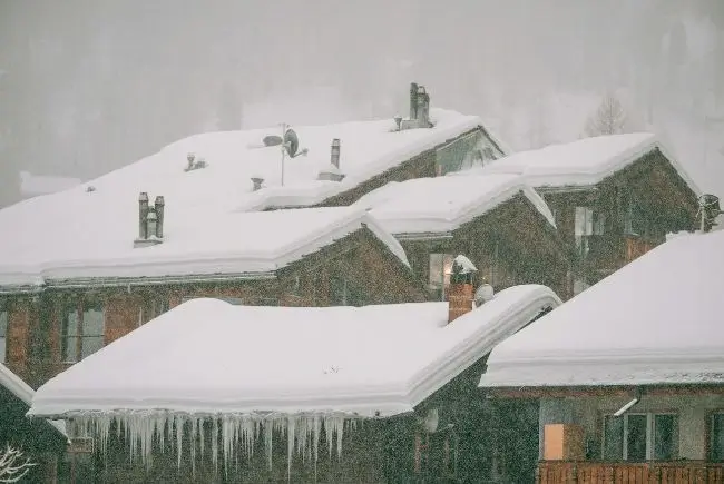 snow covered roofs and ice dams